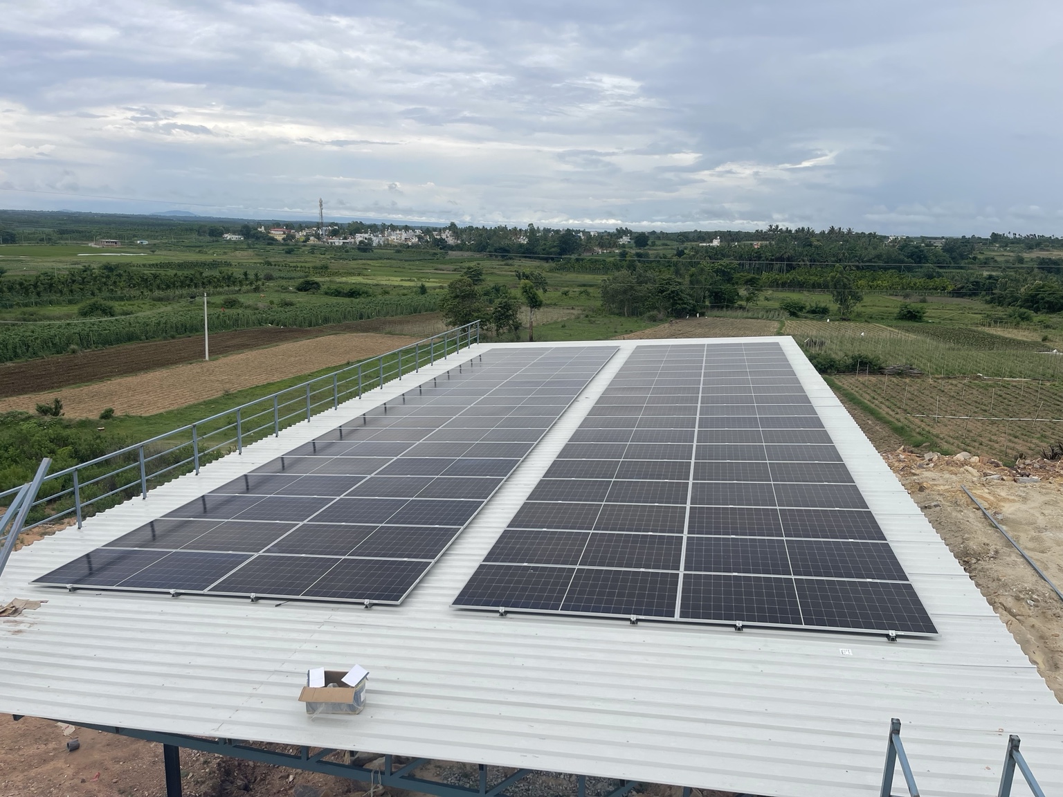 Two rows of solar panels mounted on a metal roof